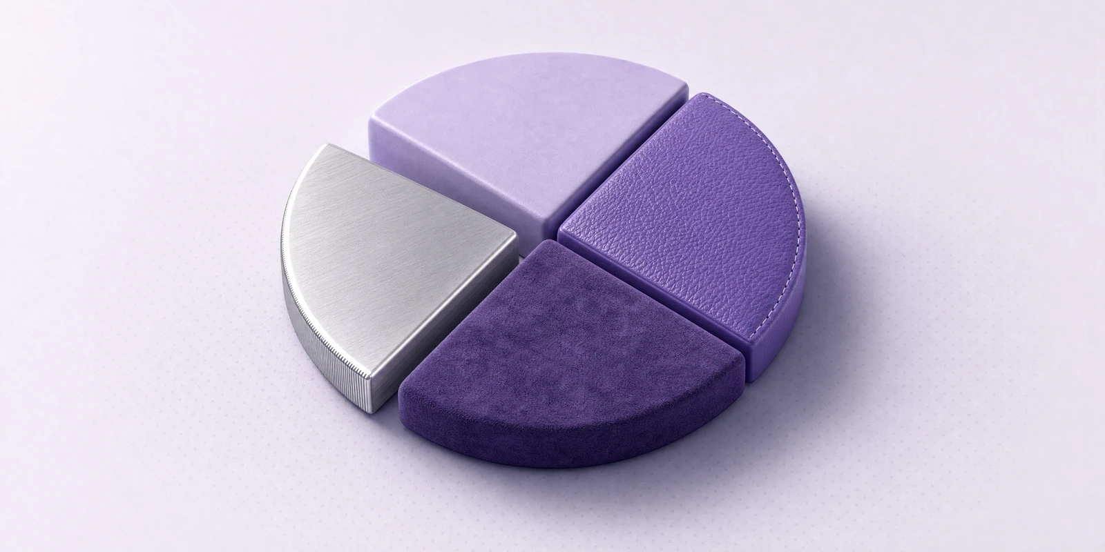 A round disc split into four wedges of different premium finishes
