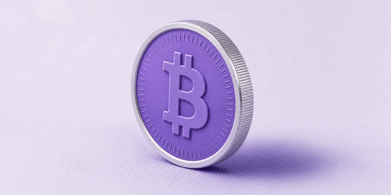 A minted coin with a violet face and embossed Bitcoin symbol standing at a slight angle