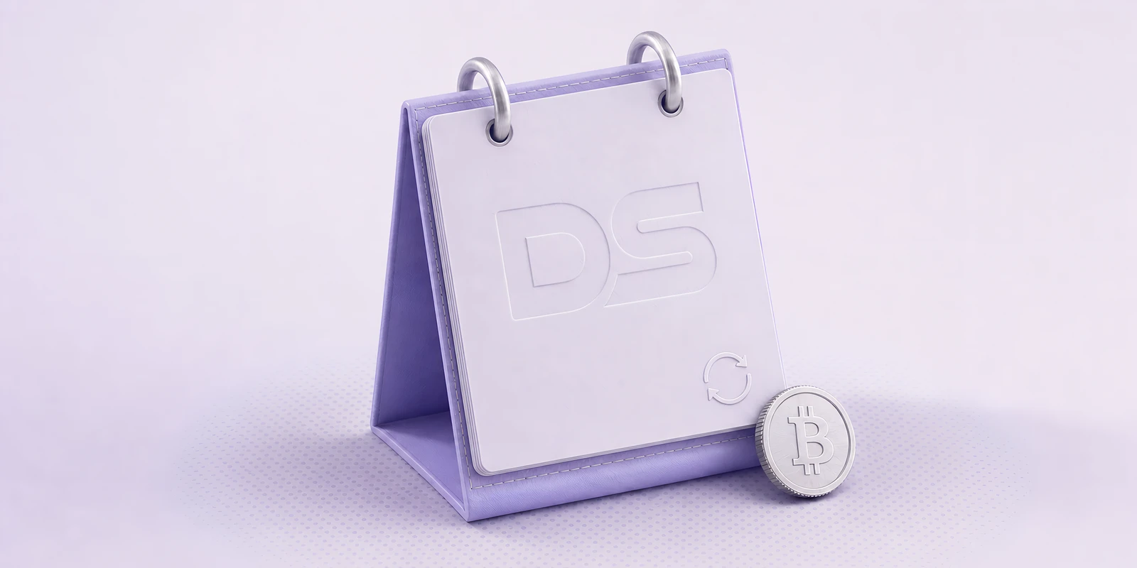 A desk calendar with a DS watermark and a Bitcoin coin leaning against it